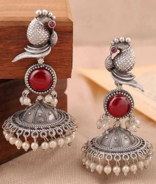 Oxidized Silver Peacock Jhumka Earrings with Red Stone & Pearl Detailing