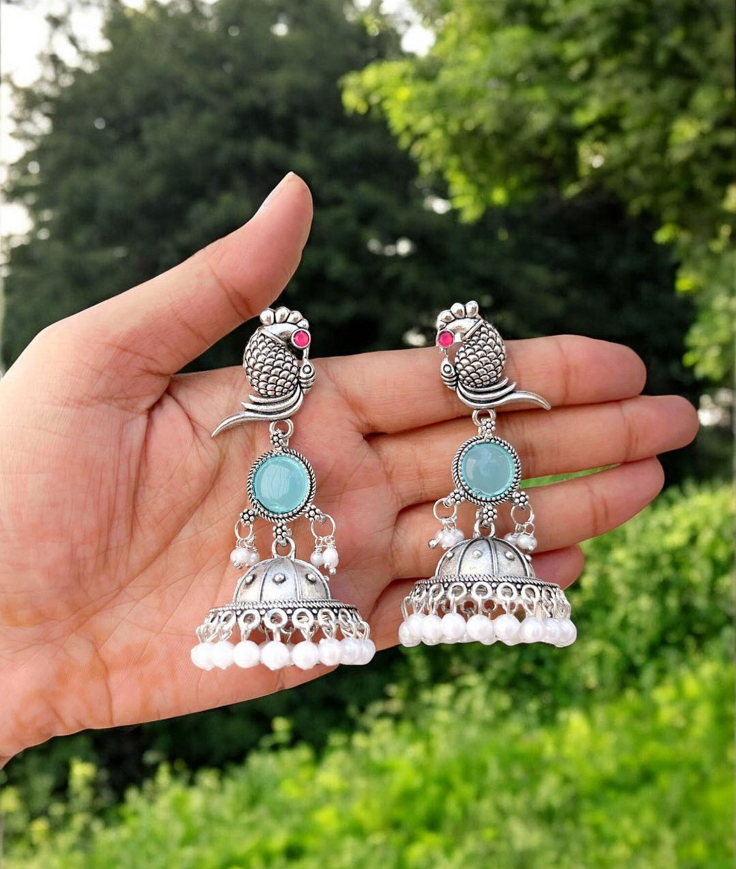 Oxidized Silver Peacock Jhumka Earrings with Blue Stone & Pearl Detailing