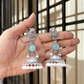 Oxidized Silver Peacock Jhumka Earrings with Blue Stone & Pearl Detailing