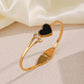 Elegant Gold-Plated Bracelet with Black Heart