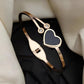 Elegant Gold-Plated Bracelet with Black Heart
